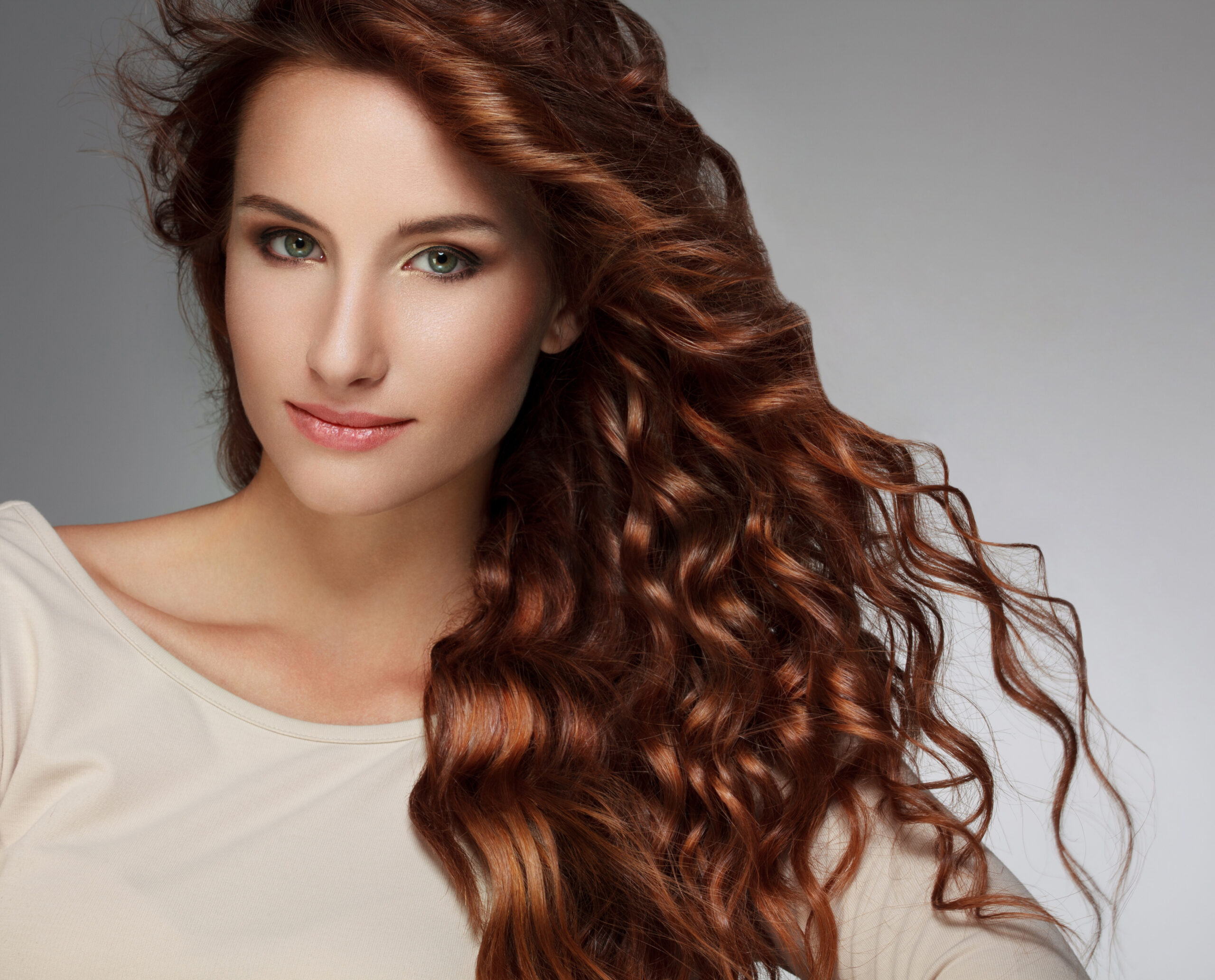 Woman with Beautiful Curly Hair Color image of female protagonist in book titled Invincible.